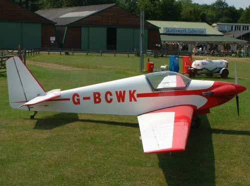 G-BCWK on the grass, Shuttleworth Collection in the background