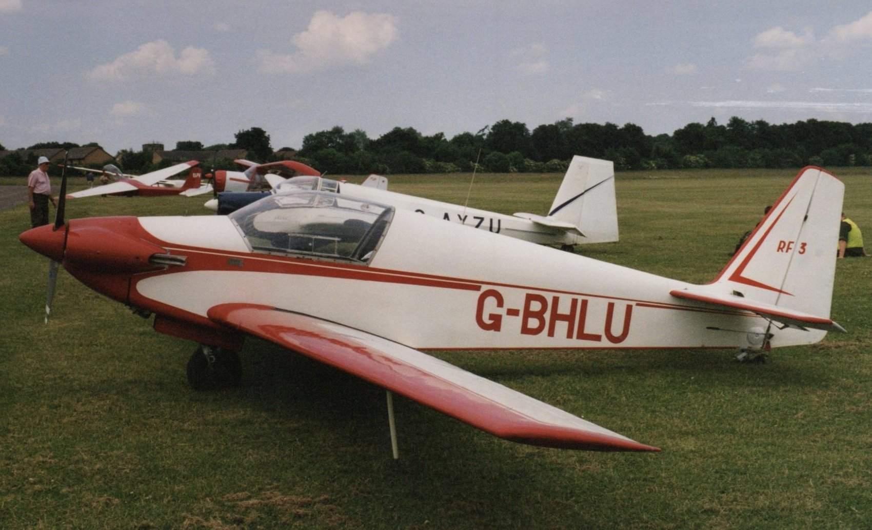 G-BHLU on the grass, tail marked RF3