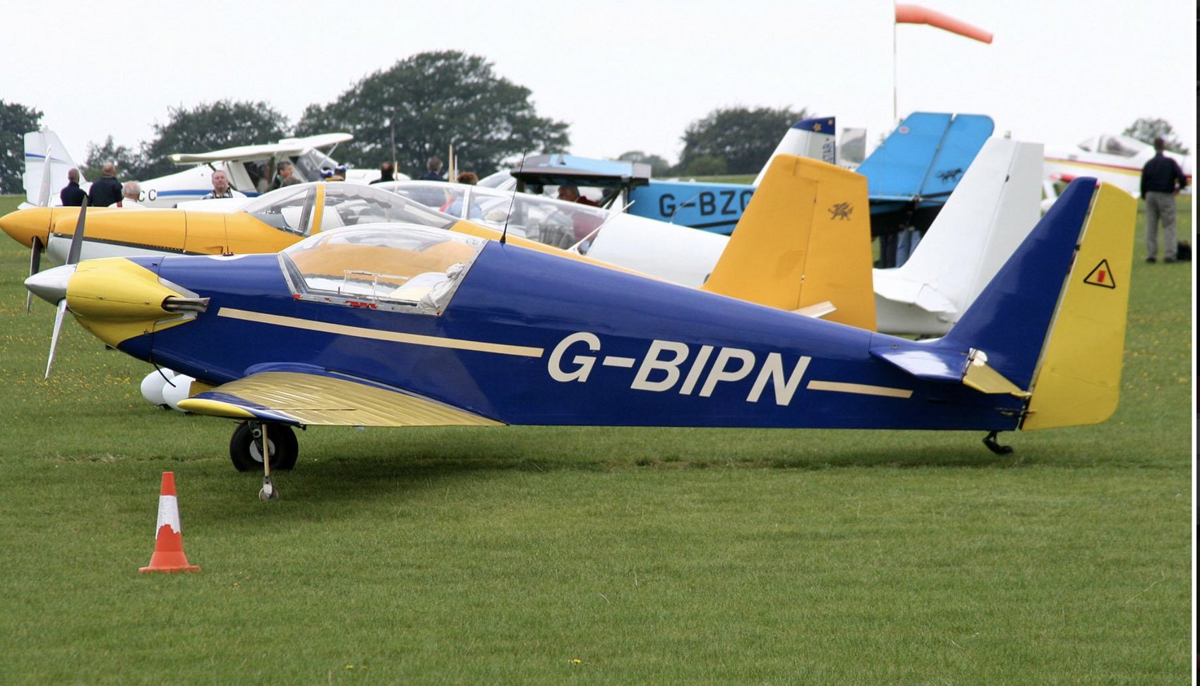G-BIPN, blue and yellow, on the grass