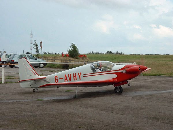 G-AVHY in red and white, on the tarmac