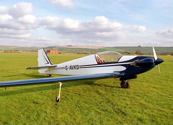 G-AVKD on the grass, downland in the background