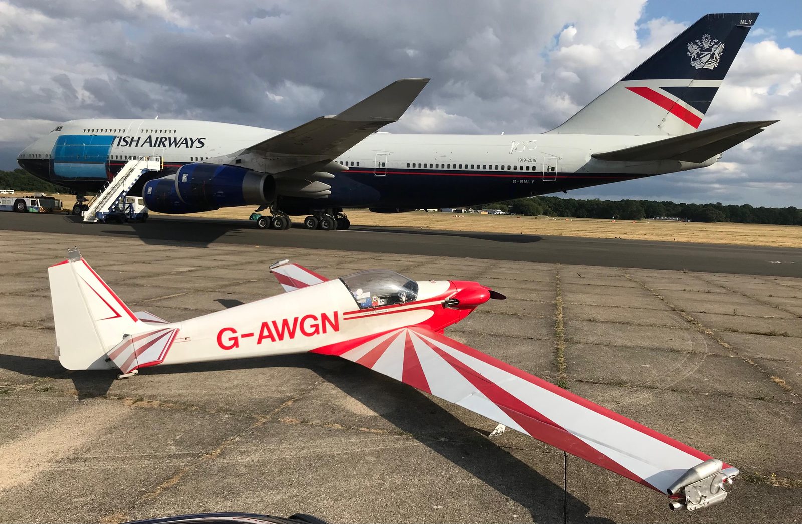 G-AWGN parked in front of a British Airways Boeing 747