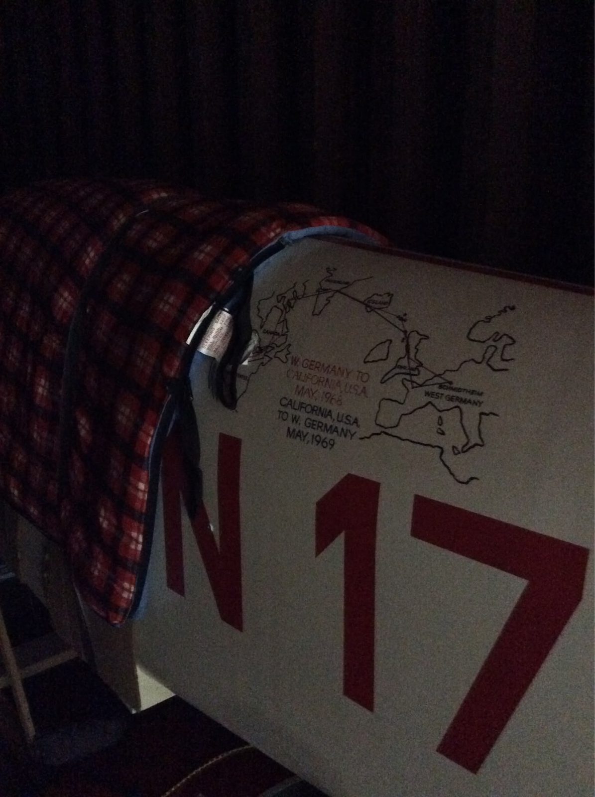 N1700 fuselage in a shipping container, signatures on the tail