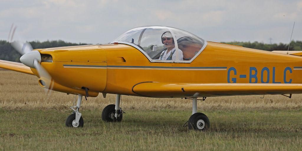RF6B G-BOLC in yellow, on the grass