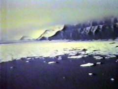 Icy, snow-covered coastline near the Faeroe Islands or Iceland