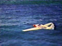 N1700 flying low over open water, seen from above