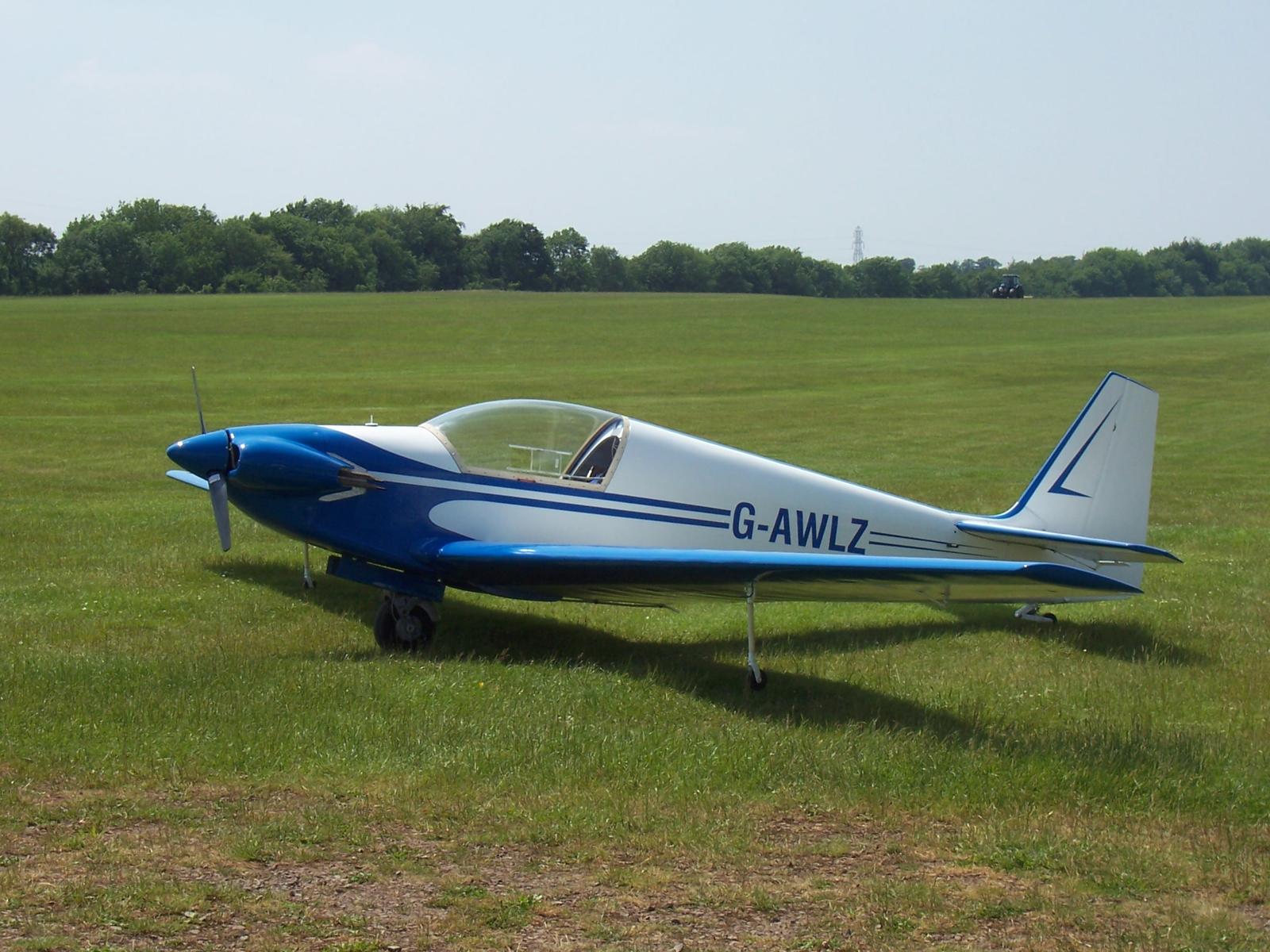 G-AWLZ finished and outside on a grass airfield