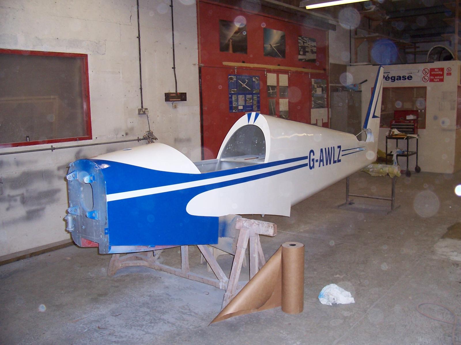 G-AWLZ nose and cockpit area, gloss white with blue trim, registration partly applied