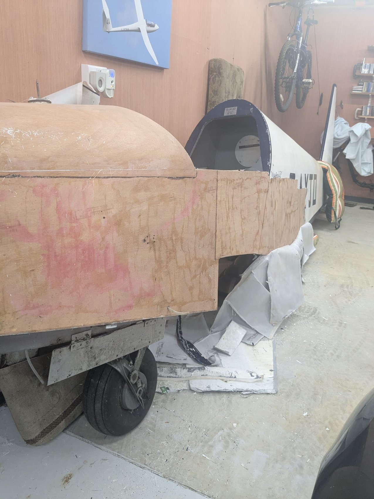 G-AYJD fuselage with new plywood skin panels fitted, cockpit surround rebuilt in wood