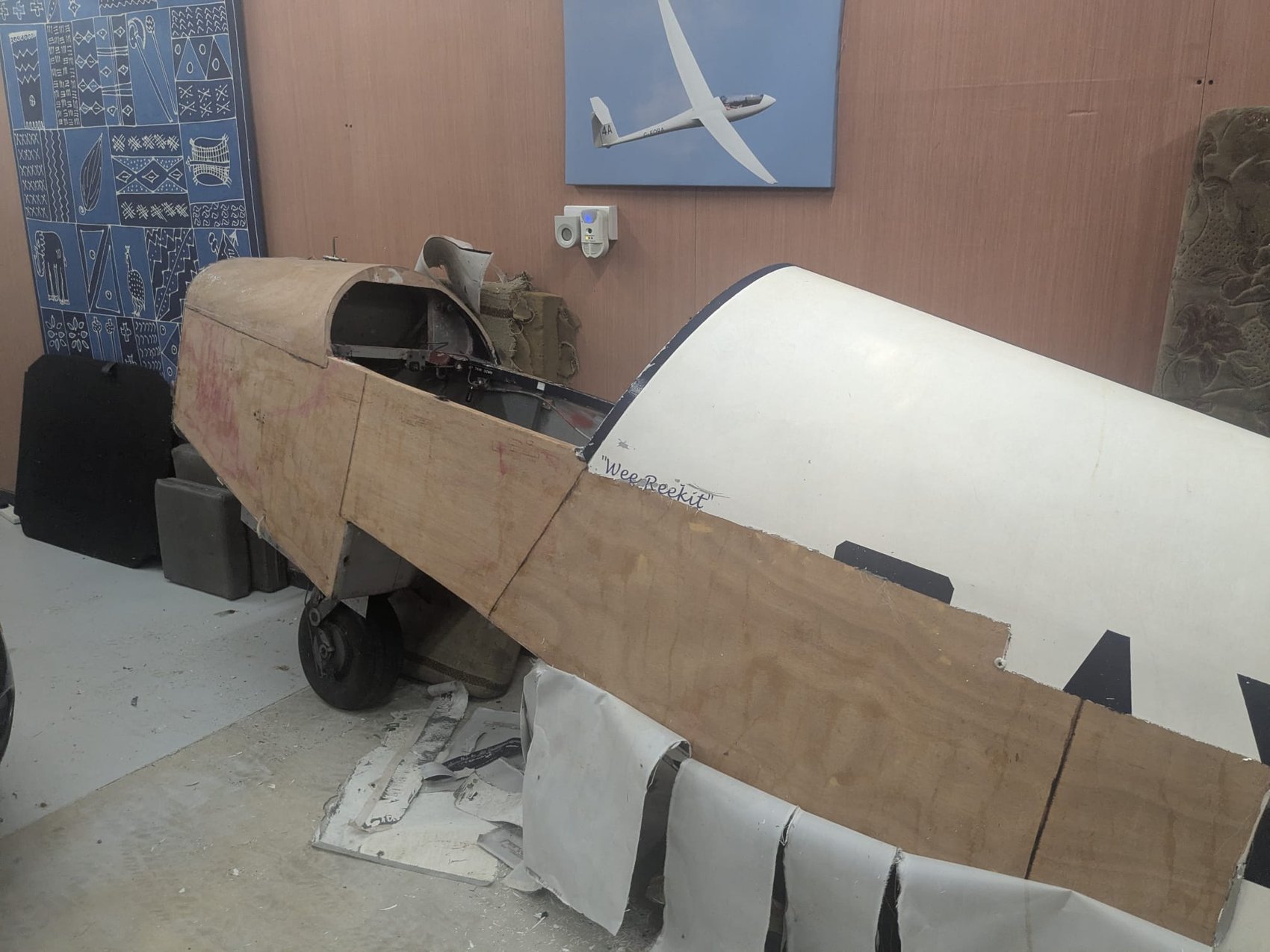 G-AYJD’s nose with new plywood skinning, the name “Wee Reekit” lettered on the original white fuselage behind